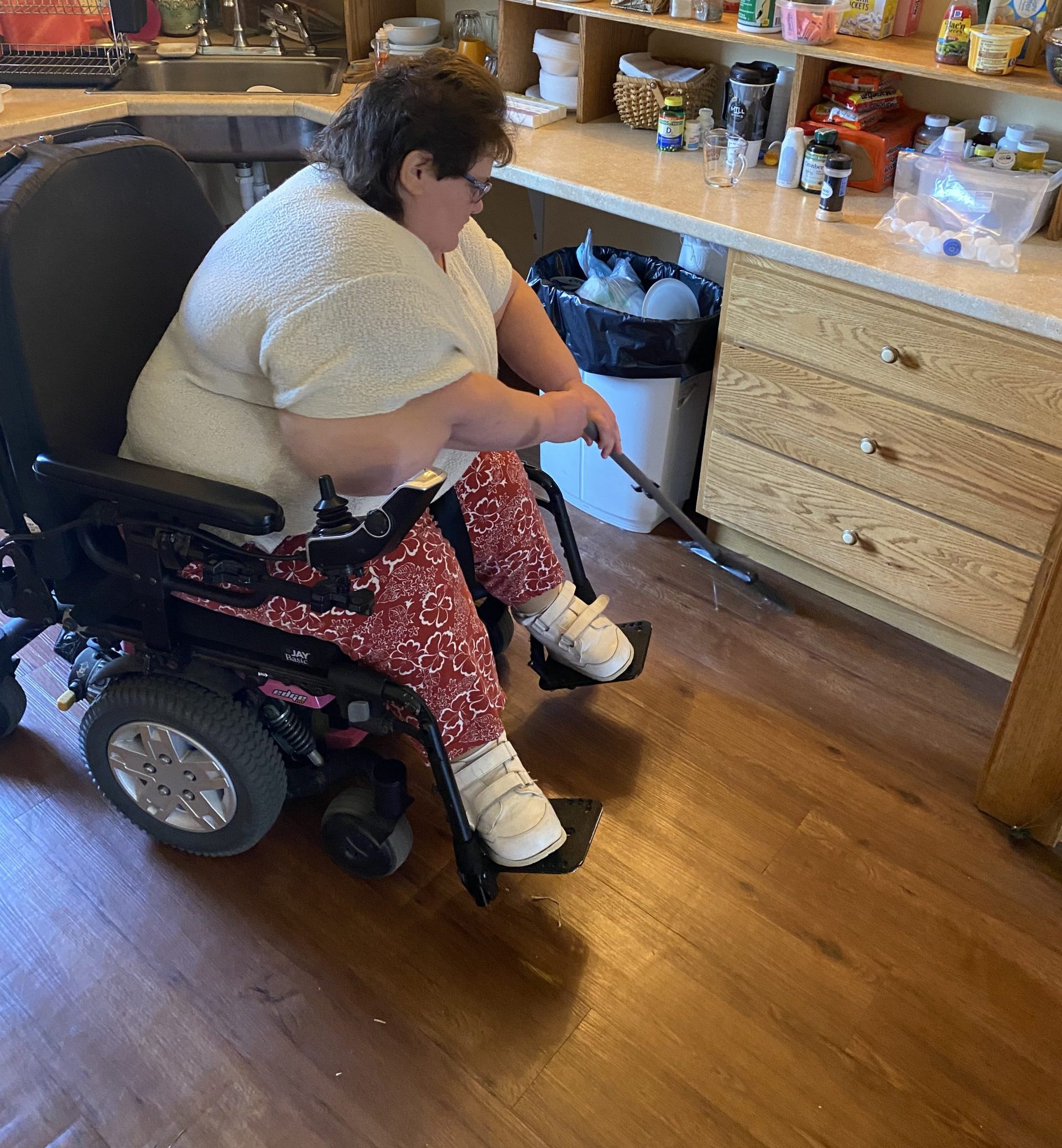 Amy takes pride in cleaning her home - The Arc Fayette H&C participant cleaning