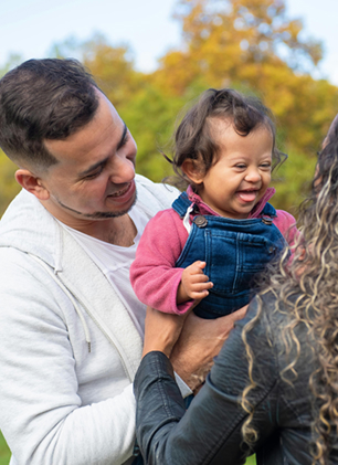 Parents holding a child