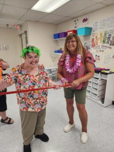 Messenger_creation_3D603B51-5AA3-4C65-A284-C6071791A8B4 Adult training facility participant and staff smiling at the Arc Fayette party