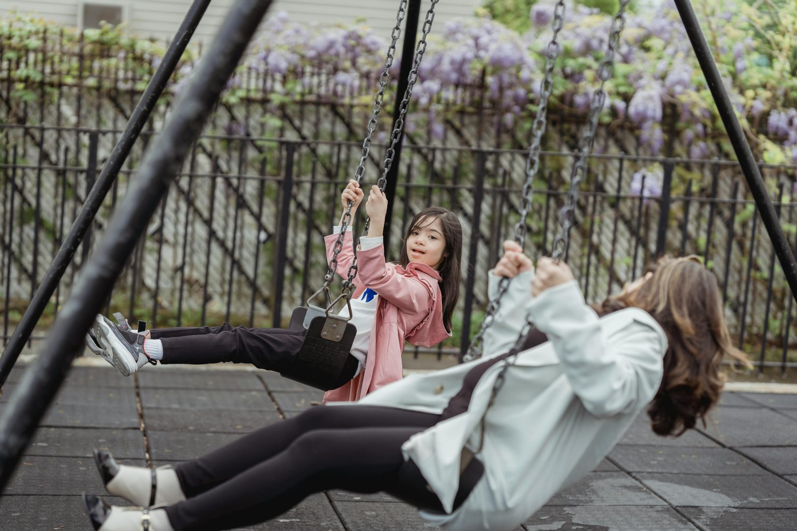2 people on swings