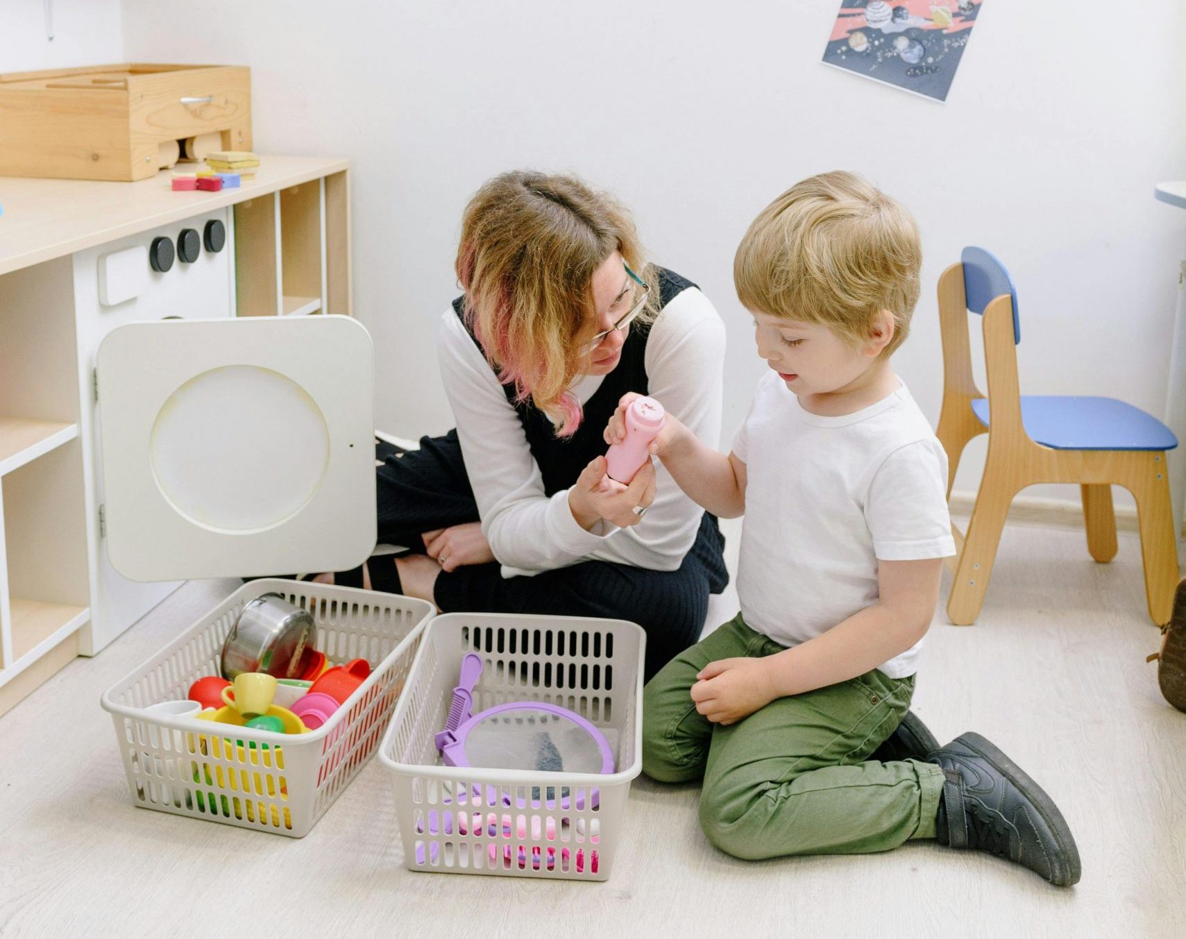 Child with adult learning through play
