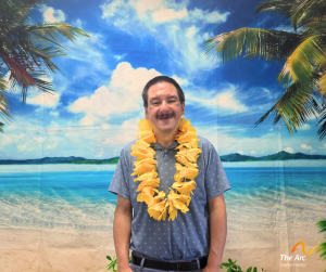 Guy posing in front of beach back drop
