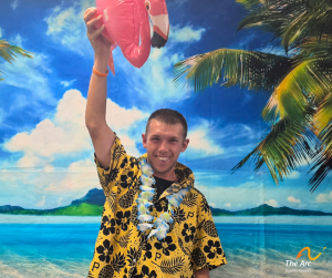 Guy posing in front of beach back drop