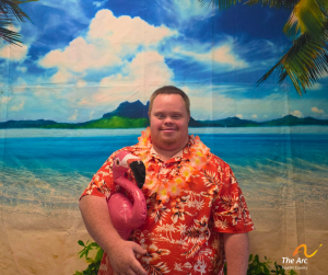 Guy posing in front of beach back drop