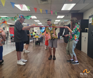 Adult Training Facility (ATF) participant playing limbo