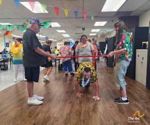 Adult Training Facility (ATF) participant playing limbo
