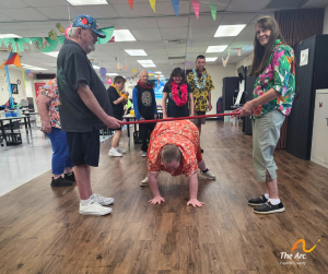 Adult Training Facility (ATF) participant playing limbo