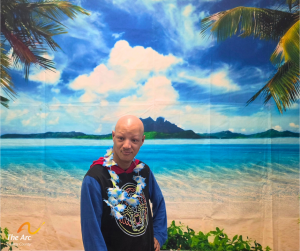 Guy posing in front of beach back drop
