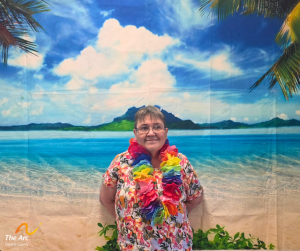 Woman posing in front of beach backdrop