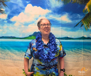 Woman posing in front of beach backdrop