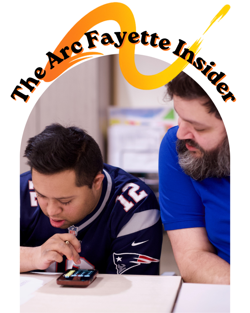 Two men work together at a desk, one writing with a pencil and a smartphone nearby; a curved 'The Arc Fayette Insider' logo arches across the top.